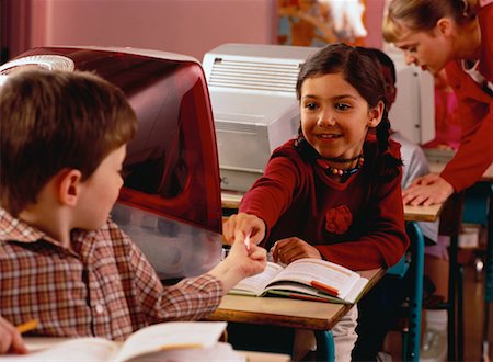 simsearch:6109-06196438,k - Boy and Girl Passing Note in Classroom Stock Photo - Rights-Managed, Code: 700-00058447
