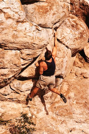 simsearch:841-07083087,k - Back View of Man Rock Climbing Stock Photo - Rights-Managed, Code: 700-00058478