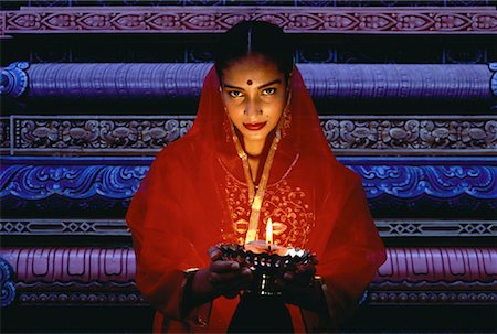 singapore traditional costume lady - Portrait of Woman Holding Oil Lamp in Temple, Singapore Stock Photo - Rights-Managed, Code: 700-00058585