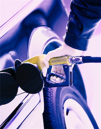 simsearch:6105-05395912,k - Close-Up of Person Pumping Gas Stock Photo - Rights-Managed, Code: 700-00058826