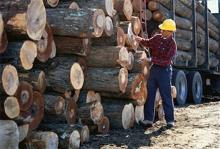 Man Measuring Cut and Stacked Lumber, Ontario, Canada Stock Photo - Rights-Managed, Code: 700-00058872