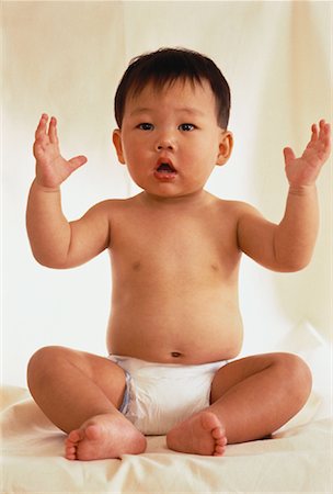 Portrait of Baby with Arms Raised Stock Photo - Rights-Managed, Code: 700-00059102