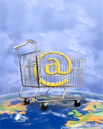 simsearch:700-01163575,k - @ Symbol in Shopping Cart on Globe Stock Photo - Rights-Managed, Code: 700-00050470