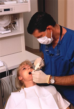 dentist with patient in exam room - Male Dentist Checking Female Patient's Teeth Stock Photo - Rights-Managed, Code: 700-00050550