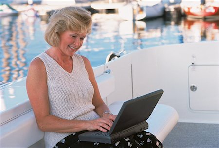 simsearch:700-00083403,k - Mature Woman Using Laptop Computer on Boat Stock Photo - Rights-Managed, Code: 700-00051212