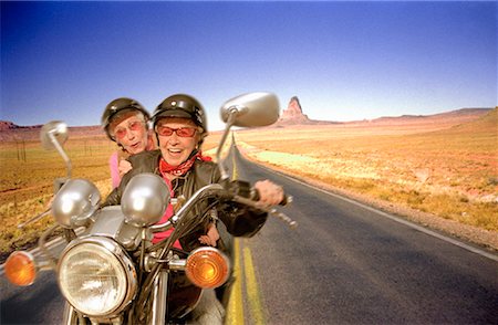 simsearch:614-06896253,k - Mature Women Riding Motorcycle Through Desert Stock Photo - Rights-Managed, Code: 700-00051406