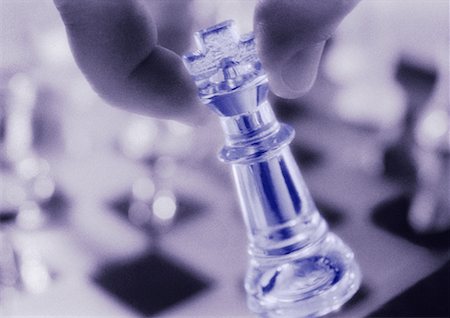 simsearch:700-00075674,k - Close-Up of Hand Holding Chess Piece Stock Photo - Rights-Managed, Code: 700-00051669
