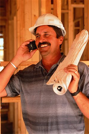 simsearch:700-00478545,k - Construction Worker Holding Plans And Using Cell Phone Stock Photo - Rights-Managed, Code: 700-00052742
