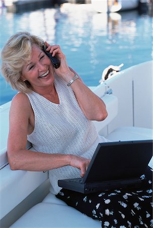 simsearch:700-00083403,k - Mature Woman in Boat Using Cell Phone and Laptop Computer Stock Photo - Rights-Managed, Code: 700-00053892