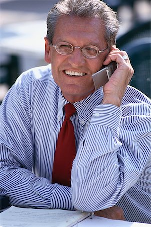 simsearch:700-00163379,k - Portrait of Mature Businessman Using Cell Phone at Outdoor Cafe Stock Photo - Rights-Managed, Code: 700-00064809