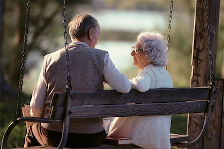 Back View of Mature Couple on Swing In Park, Miami, FL, USA Stock Photo - Rights-Managed, Code: 700-00065295