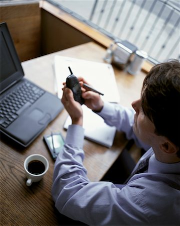 simsearch:700-00163379,k - Overhead View Of Businessman In Restaurant Using Cell Phone Stock Photo - Rights-Managed, Code: 700-00065319