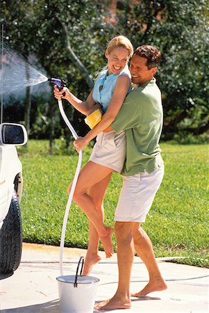 simsearch:700-00593102,k - Couple Embracing, Washing Car Stock Photo - Rights-Managed, Code: 700-00065617