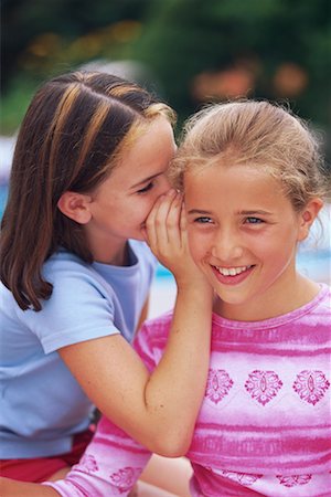 pictures of a little girl whispering - Girls Whispering Outdoors Stock Photo - Rights-Managed, Code: 700-00066356