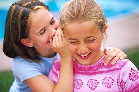 pictures of a little girl whispering - Girls Whispering, Laughing Outdoors Stock Photo - Rights-Managed, Code: 700-00066357