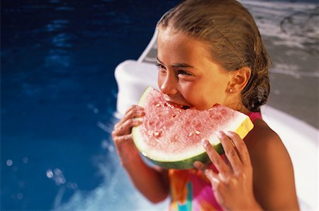 simsearch:700-00057270,k - Girl in Swimwear, Eating Watermelon near Swimming Pool Stock Photo - Rights-Managed, Code: 700-00066658