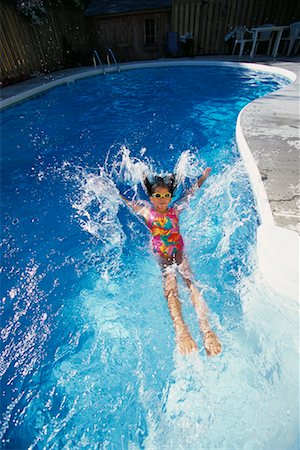 simsearch:700-00057270,k - Girl in Swimwear and Goggles Jumping into Swimming Pool Stock Photo - Rights-Managed, Code: 700-00066661