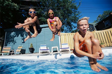 simsearch:695-03374346,k - Three Children Jumping into Swimming Pool Stock Photo - Rights-Managed, Code: 700-00066670