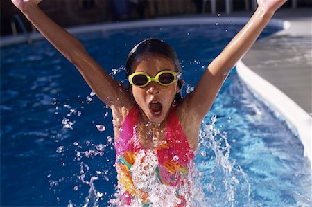 simsearch:700-00057270,k - Girl in Swimwear and Goggles Jumping in Swimming Pool Stock Photo - Rights-Managed, Code: 700-00066819
