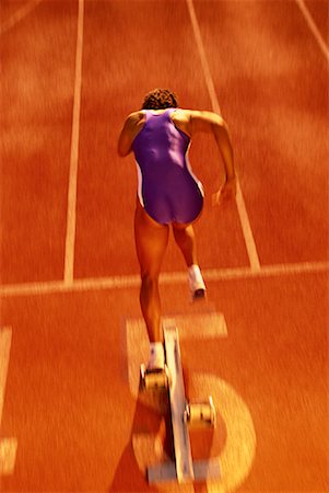 simsearch:700-00157314,k - Back View of Woman Running on Track Stock Photo - Rights-Managed, Code: 700-00066940