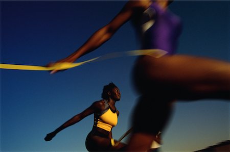 simsearch:700-00607186,k - Blurred View of Women Crossing Finish Line of Race Stock Photo - Rights-Managed, Code: 700-00066942