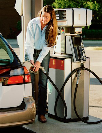 simsearch:6105-05395912,k - Woman Pumping Gas at Gas Station Stock Photo - Rights-Managed, Code: 700-00067169