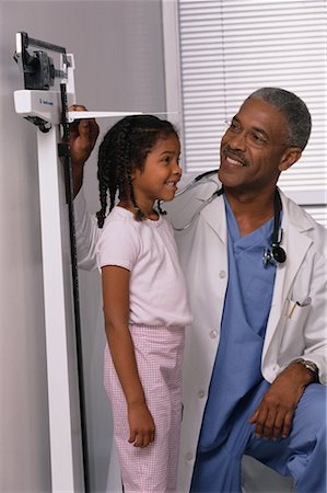 simsearch:700-00616627,k - Mature Male Doctor Measuring Girl's Height in Office Stock Photo - Rights-Managed, Code: 700-00067489