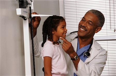 simsearch:700-00616627,k - Mature Male Doctor Measuring Girl's Height in Office Stock Photo - Rights-Managed, Code: 700-00067491