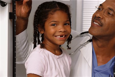 simsearch:700-00616627,k - Portrait of Girl Having Height Measured by Mature Male Doctor Stock Photo - Rights-Managed, Code: 700-00067492