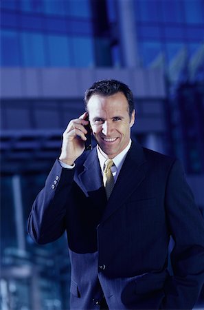 simsearch:700-00163379,k - Portrait of Businessman Using Cell Phone near Office Tower Toronto, Ontario, Canada Stock Photo - Rights-Managed, Code: 700-00068442