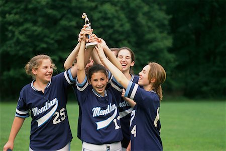 simsearch:700-00268752,k - Girls Softball Team Holding Trophy Outdoors Stock Photo - Rights-Managed, Code: 700-00068773