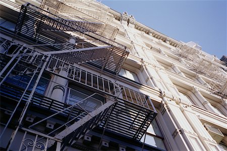 simsearch:700-01694071,k - Looking Up at Building and Fire Escape, Soho, New York, New York USA Stock Photo - Rights-Managed, Code: 700-00069156