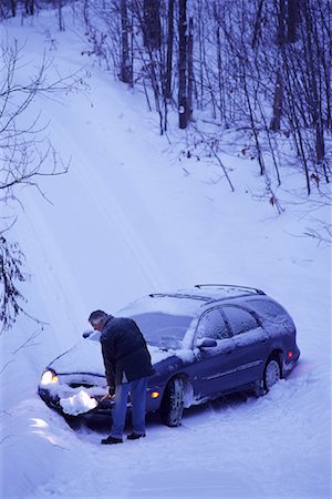 Mature Man Shovelling Snow in Front of Car Stock Photo - Rights-Managed, Code: 700-00069905
