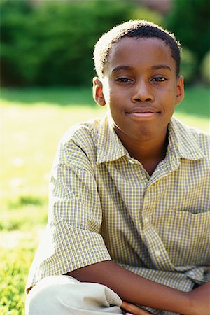 Portrait of Boy Sitting Outdoors Stock Photo - Rights-Managed, Code: 700-00069965