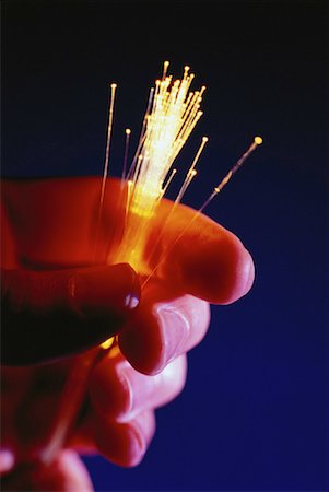 simsearch:614-05399875,k - Close-Up of Hand Holding Fiber Optics Stock Photo - Rights-Managed, Code: 700-00060229