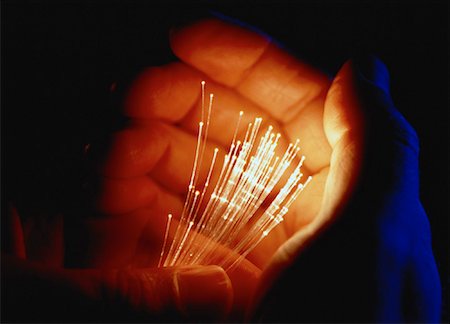 simsearch:614-05399875,k - CLose-Up of Cupped Hands Holding Fiber Optics Stock Photo - Rights-Managed, Code: 700-00060230