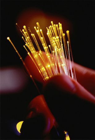 simsearch:614-05399875,k - Close-Up of Hand Holding Fiber Optics Stock Photo - Rights-Managed, Code: 700-00060309