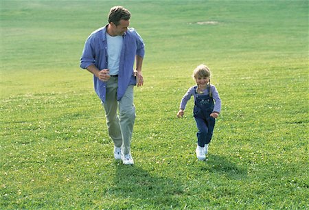 peter griffith - Father and Daughter Running Through Field Stock Photo - Rights-Managed, Code: 700-00060324