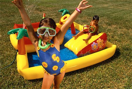 simsearch:700-00280017,k - Boy and Girl Wearing Swimwear Playing with Inflatable Pool Stock Photo - Rights-Managed, Code: 700-00060775