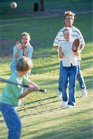 Family Playing Baseball in Field Stock Photo - Rights-Managed, Code: 700-00061329