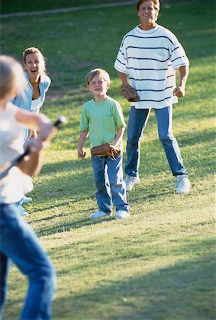 Family Playing Baseball in Field Stock Photo - Rights-Managed, Code: 700-00061331