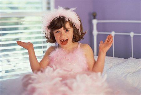 feather boa - Portrait de jeune fille assise sur le lit portant Costume Ballerina Photographie de stock - Rights-Managed, Code: 700-00061479