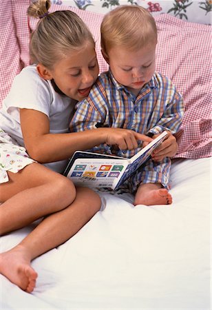 simsearch:700-00912081,k - Girl Reading Book to Young Boy On Bed Stock Photo - Rights-Managed, Code: 700-00061527