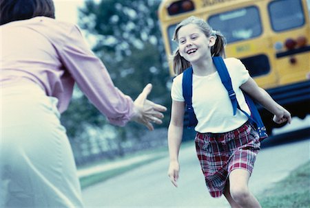 excited kids on first day of school - Mother Greeting Daughter near School Bus Stock Photo - Rights-Managed, Code: 700-00061554