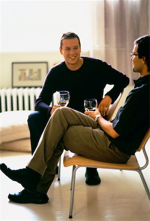 simsearch:614-02613435,k - Male Couple Sitting in Chairs Holding Glasses of Wine Stock Photo - Rights-Managed, Code: 700-00061558