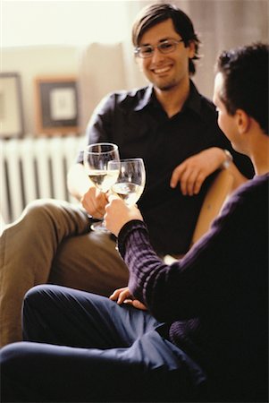 simsearch:614-02613435,k - Male Couple Sitting in Chairs Toasting with Glasses of Wine Stock Photo - Rights-Managed, Code: 700-00061877
