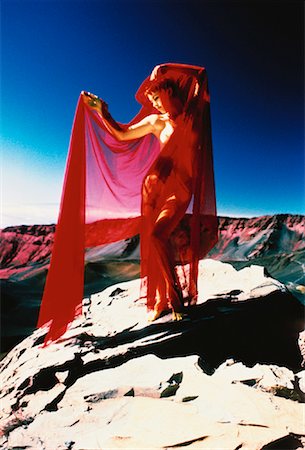 Nude Woman Standing on Rock Holding Sheer Red Fabric Stock Photo - Rights-Managed, Code: 700-00062149