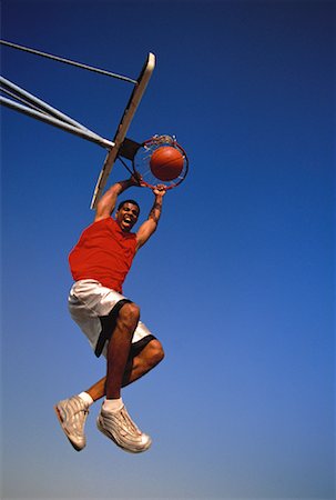 simsearch:700-00060777,k - Man Hanging from Rim of Basketball Net, Yelling Outdoors Stock Photo - Rights-Managed, Code: 700-00062410