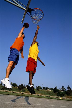 peter griffith - Two Men Jumping in Air, Playing Basketball Outdoors Stock Photo - Rights-Managed, Code: 700-00062413