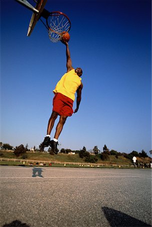 simsearch:700-00060777,k - Man Jumping in Air to Finger Roll Basketball into Net Stock Photo - Rights-Managed, Code: 700-00062513